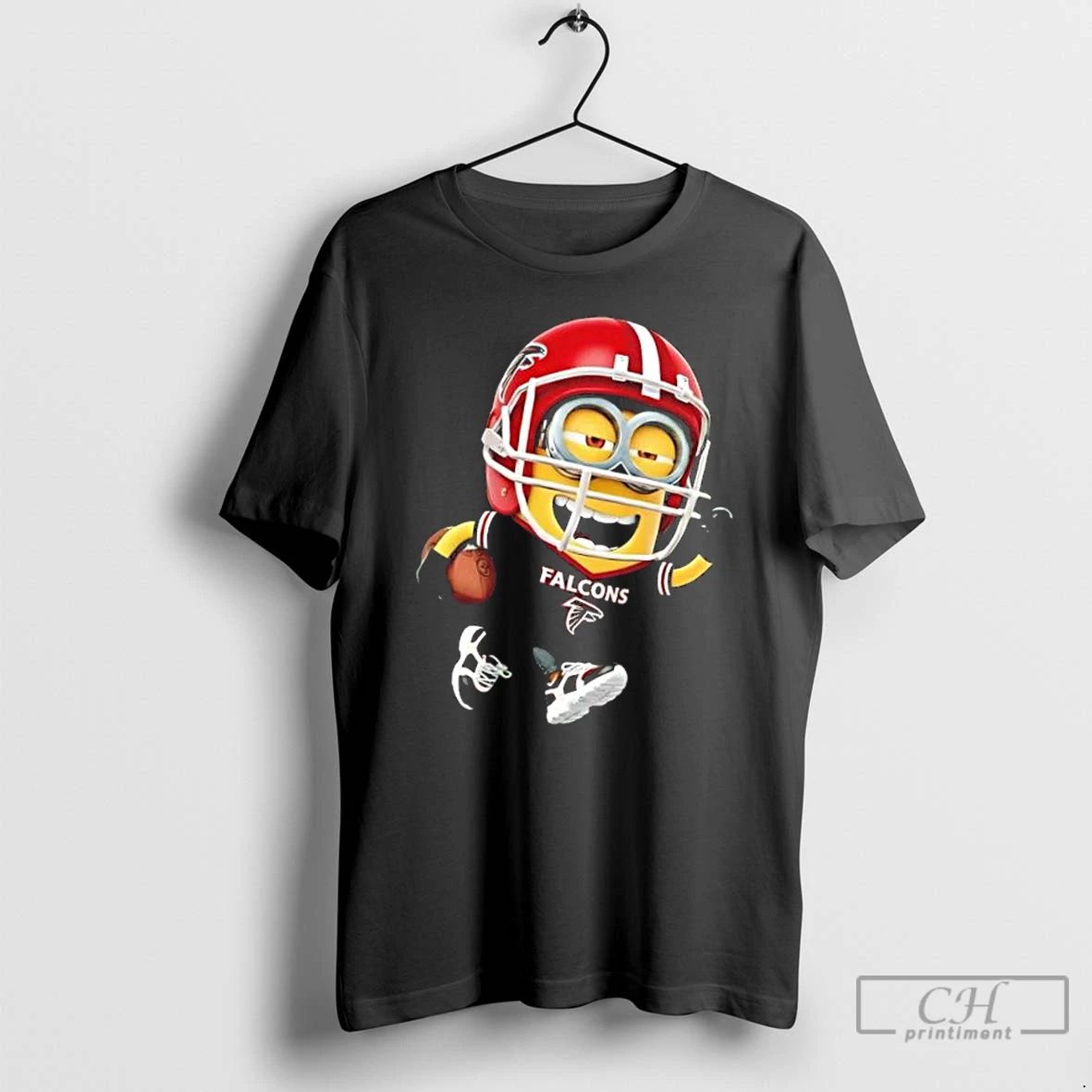 Premium Minions Is Holding A Ball And Smiling At Atlanta Falcons Fans T Shirts Unisex T-shirt, Sweatshirt, Hoodie, Long Sleeve Tee